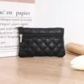 Black quilted PU leather coin purse with double zippers, compact design for keys and cards. - Black