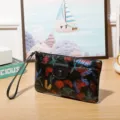 Women vintage floral embossed clutch wallet with wrist strap and snap closure daily use. - Black