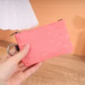 Pink waterproof windbreaker coin purse with bone pattern, metal zipper and practical key ring. - Pink