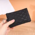 Black fabric coin purse key holder with bone pattern and ring keychain for portable daily use. - Black