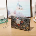Vintage embossed floral leather clutch wallet with butterfly pattern and wrist strap. - Silver