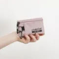 Portable Oxford cloth coin purse with keyring and zipper, ideal for daily card and key storage. - Pink