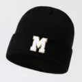 Black knitted beanie hat with white letter M patch, winter warm casual streetwear cap. - Adjustable / Letter M