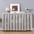 Detail view of sheer dust curtain with floral appliques and lace trim, styled on storage cabinet. - Flat Width 2m Height 40cm / Linen Flower