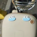 Cute electric scooter decoration sticker featuring blue monster face design for custom rides. - Blue