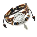 Vintage Bohemian style brown leather bracelet watch with a leaf feather pendant charm - Brown