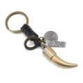 Vintage bronze alloy animal tooth keychain with black leather braid and engraved quote - Black Leather
