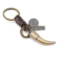Vintage bronze alloy animal tooth keychain with a brown braided leather strap for bags - Brown Leather