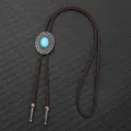 Vintage bolo tie met turquoise, gevlochten bruin koord en sierlijke zilveren punten. - Donkerbruin