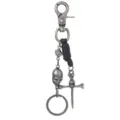 Vintage punk metal skull keychain with leather detail and dice charm on white background - Retro Silver Style / Black Leather