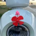 Decorazione per auto con elica luminosa rotante eolica con simpatico orsetto rosa. - Piccolo Aeroplano Luminoso Orso Sdraiato 1 Pz