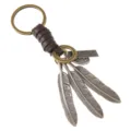 Vintage handmade leather keychain with alloy feather charms and engraved metal plate - Brown Leather