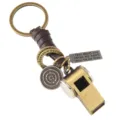 Vintage metal whistle keychain with a dark brown leather wrap and engraved metal charms. - Brown Leather