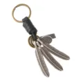 Vintage handmade leather feather keychain with alloy pendants and unique heart message tag. - Black Leather