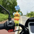 Cute cartoon capybara handlebar decoration with spinning pinwheel, close-up view. - Crying Loudly (Strap Type)