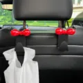 Autostoelhaak met schattige rode strik, zwarte stoelorganizer tas ophanghaak handig. - 2 Stuks/Set / Zwart (Rode Strik)