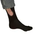 Close-up detail of funny novelty black crew socks with pixelated funny pattern design. - Jacquard / Black