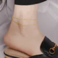 Elegantes zweilagiges Fußkettchen aus Titanstahl mit Goldperlen und Steinanhänger - Doppelschicht Ein Strass (B5013) / Gold
