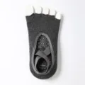 Dark grey five toe yoga socks with anti-slip grip sole and cross straps for fitness. - One Size / Gray Half Toe