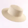 Classic beige straw sun hat with wide brim, perfect for summer beach and outdoor travel. - Plain Flat Top Beige Straw Hat