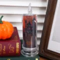 Close-up of Halloween LED simulation candle with castle design and transparent flame tip. - Pumpkin Ghost (With Candlestick) / 6.5x18cm