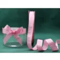 Close-up detail view of pink and white gingham ribbon roll and elegant bow decoration. - Light Pink