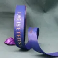 Blue grosgrain ribbon detail with gold foil text love is eternal for bouquet packaging decor. - Navy Blue