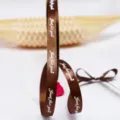 1cm brown satin ribbon detail shot, featuring English text for gift wrapping and DIY crafts. - Coffee