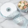 Light blue polka dot ribbon roll detail, 2.5cm wide fabric trim for gift wrapping and party decor. - Light Blue