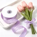 Detailed view of 2.5cm purple polka dot ribbon styled with lovely pink tulip bouquet for decoration. - Taro Purple