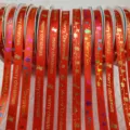 Christmas red ribbon with gold printed merry christmas letters and festive holiday patterns. - 1.0 cm x 25 Yards / Red