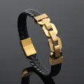 Detailed close-up of black braided microfiber leather strap and gold steel chain links - Gold