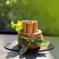 Wooden car aroma diffuser with cinnamon sticks, walnut finish, green ribbon decor. - Cinnamon Galaxy