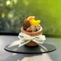 Wooden car aromatherapy ornament with dried flowers and pine cones for dashboard decor. - Golden Safe Journey