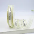 2.5cm wide organza ribbon with gold edge and happy birthday print for gift wrapping flower decor - Off White
