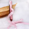 Pink 1cm satin ribbon roll for gift wrapping, DIY crafts, and decorative ribbon bows. - Light Pink