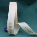 White grosgrain ribbon with gold foil LOVE IS ETERNAL print for gift wrapping and flower bouquets. - Off White