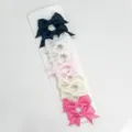 Close-up detail shot of colorful ribbon bow hair clips set on display card, sweet style. - 6cm Grosgrain Fishtail 10 Pcs/Card [09]