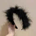Close-up detail of fluffy black feather headband, elegant winter hair accessory for women. - Fluffy Wide Headband / Black