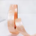 Nastro in poliestere arancione chiaro con stampa, ideale per la confezione di regali. - Champagne