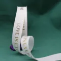 White grosgrain ribbon with gold foil English text print for gift wrapping and bouquets. - Bleached White