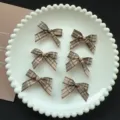 Close-up detail of brown plaid ribbon small bow hair clips, cute checkered hair accessory. - Dark Coffee Plaid