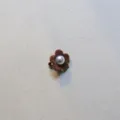 Detail view of a cute brown flocked flower hair clip featuring a delicate pearl center design. - Flocked Plum Blossom Pearl Hairclip / Coffee