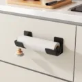 Punch-free kitchen paper towel holder wall mounted plastic wrap storage rack black variant. - 1 Pair / Black