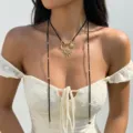 Detailed view of bohemian sun pendant choker on model wearing white lace dress - Black Sun Moon Pendant Style (XK26Y0648-1)