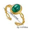 Close-up of vintage gold stainless steel ring with green malachite stone and size markers - 1.8cm / Hollow Hammered Turquoise