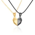Pair of magnetic heart-shaped wish stone pendants on gold chain and black cord - Gold + Black
