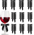 Detail view of black satin bows and wine glass scene for party gift packaging decor. - Black