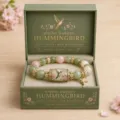 Detailed view of a hummingbird crystal beaded bracelet nestled in a Spring Garden gift box - Hummingbird Bracelet Gift Box Set