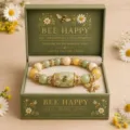 Detailed view of the bee and sunflower crystal bracelet in a premium green gift box - Green Bee Bracelet Gift Box Set